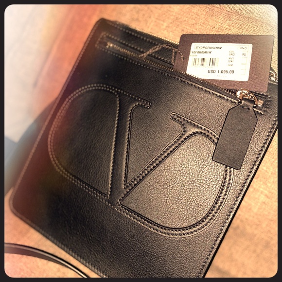 Selling a man purse . Valentino brand .Brand new